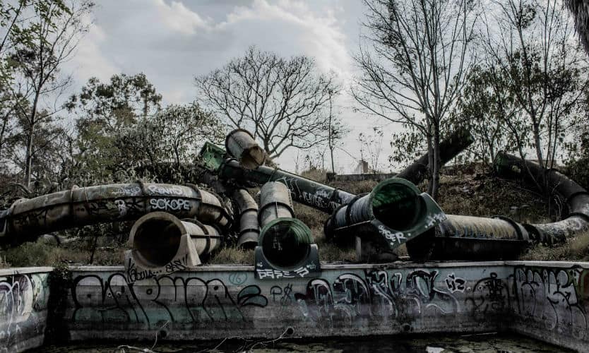 Abandoned waterslides covered in graffiti