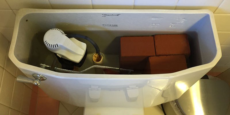 put a brick in toilet to reduce water usage