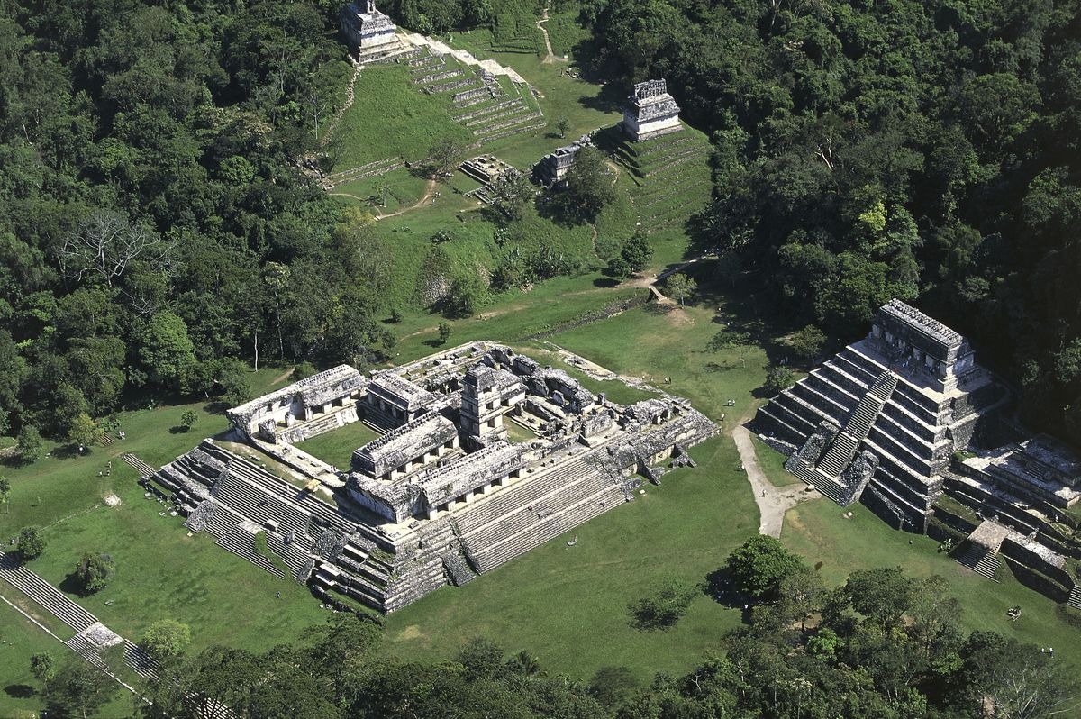 Aerial view over El Palacio and the Temple of the Inscriptions, archaeological site of Palenque in Mexico.