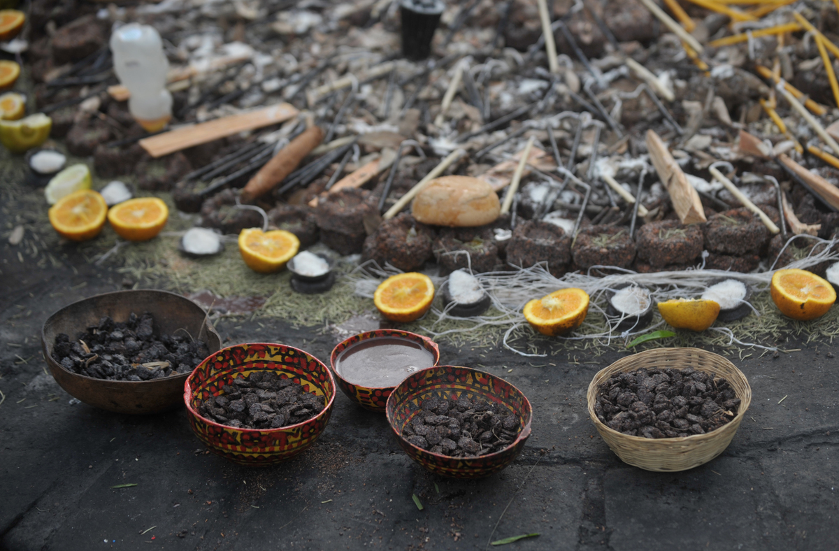 Cacao, candles, cigars, oranges and ocote wood are seen during the celebration of 