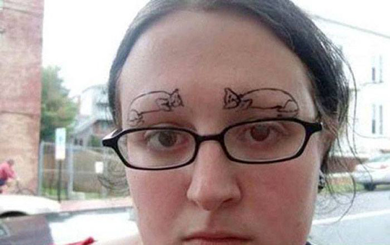 a woman with cat eyebrows