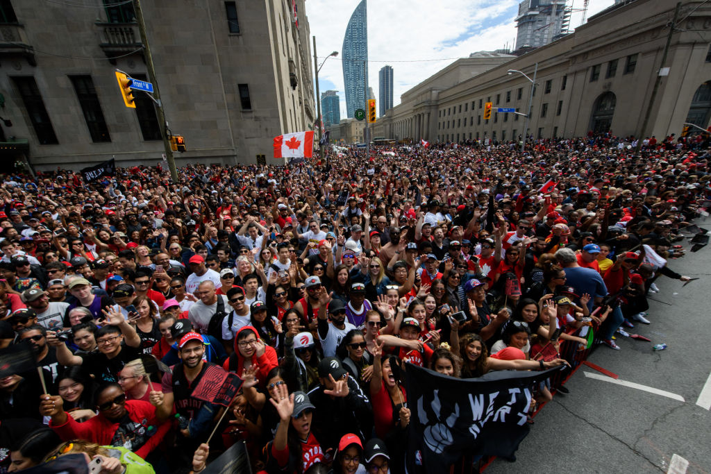 Fans cheer as they wait for the Toronto Raptors Championship parade-1150381198