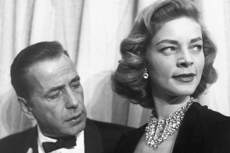 Actors Humphrey Bogart and Lauren Bacall attend the Academy Awards in 1955