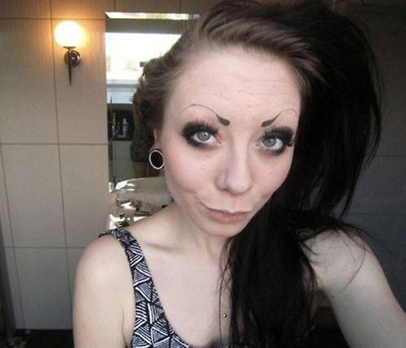 a woman with thin eyebrows
