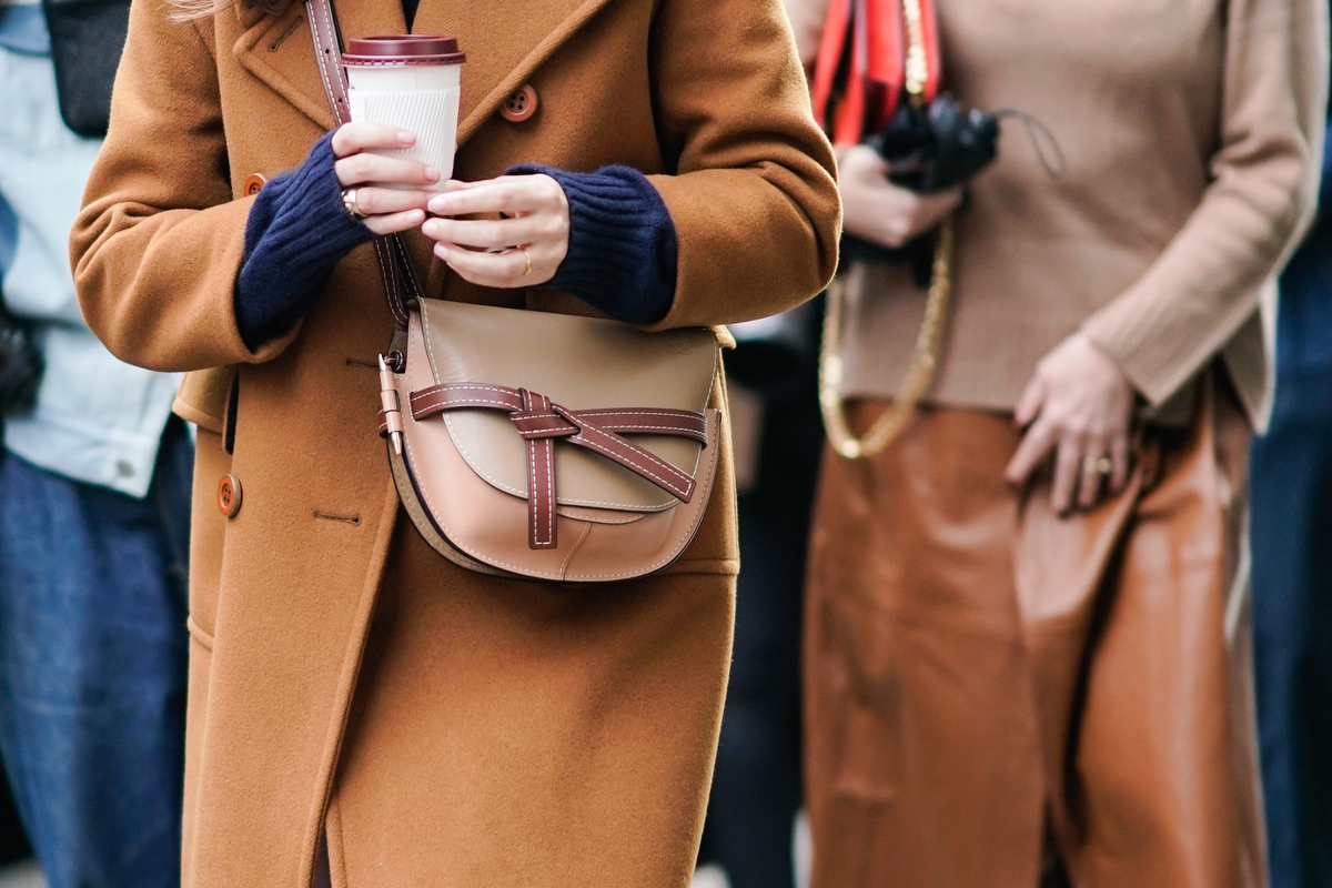 woman walking with coffee