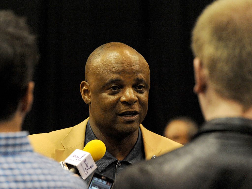 warren moon-488339063 MAY 4, 2014 - CLEVELAND, OH: Hall of Fame quarterback Warren Moon answers questions from the media during the first Pro Football Hall of Fame Fan Fest at the IX Center in Cleveland, Ohio on May 4, 2014.