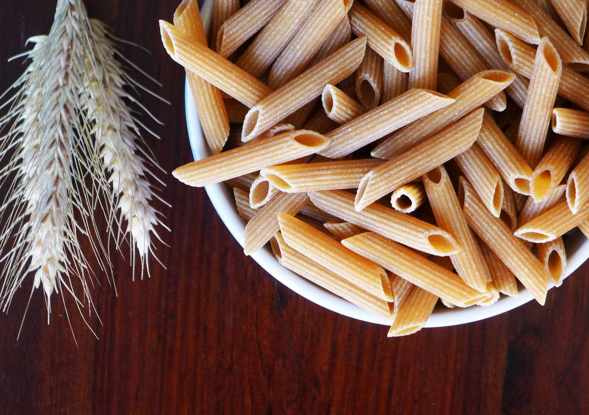 Whole wheat penne pasta in a bowl