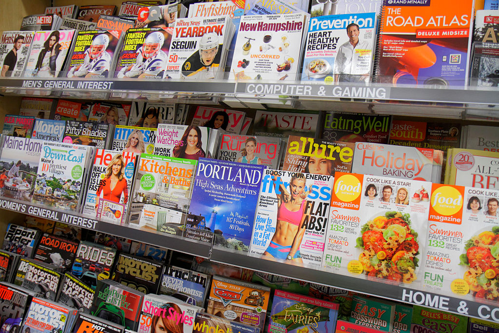 magazines on display at a grocery store