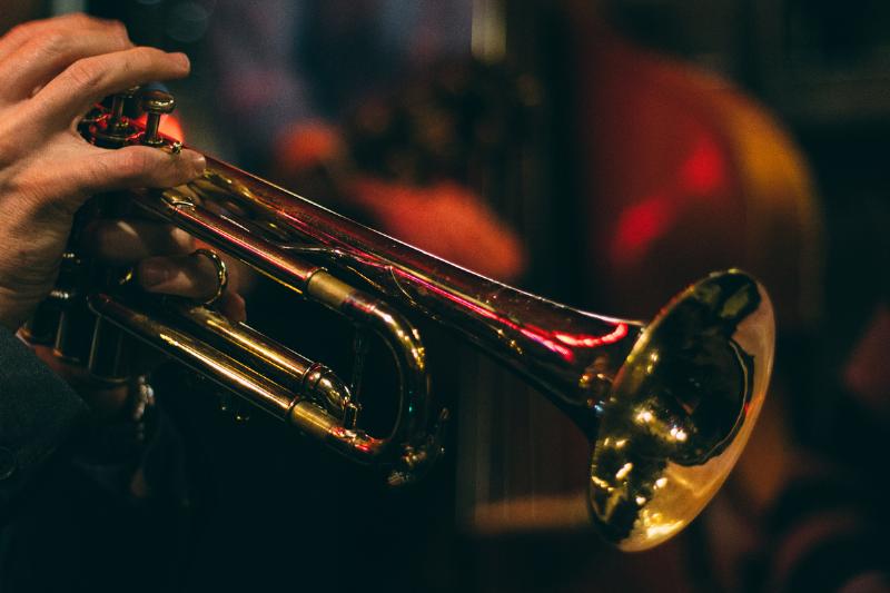 Musician plays a brass trumpet