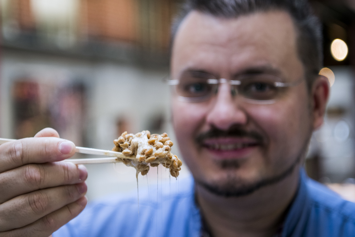 Museum curator tries Natto, a type of legume made from fermented soybeans.
