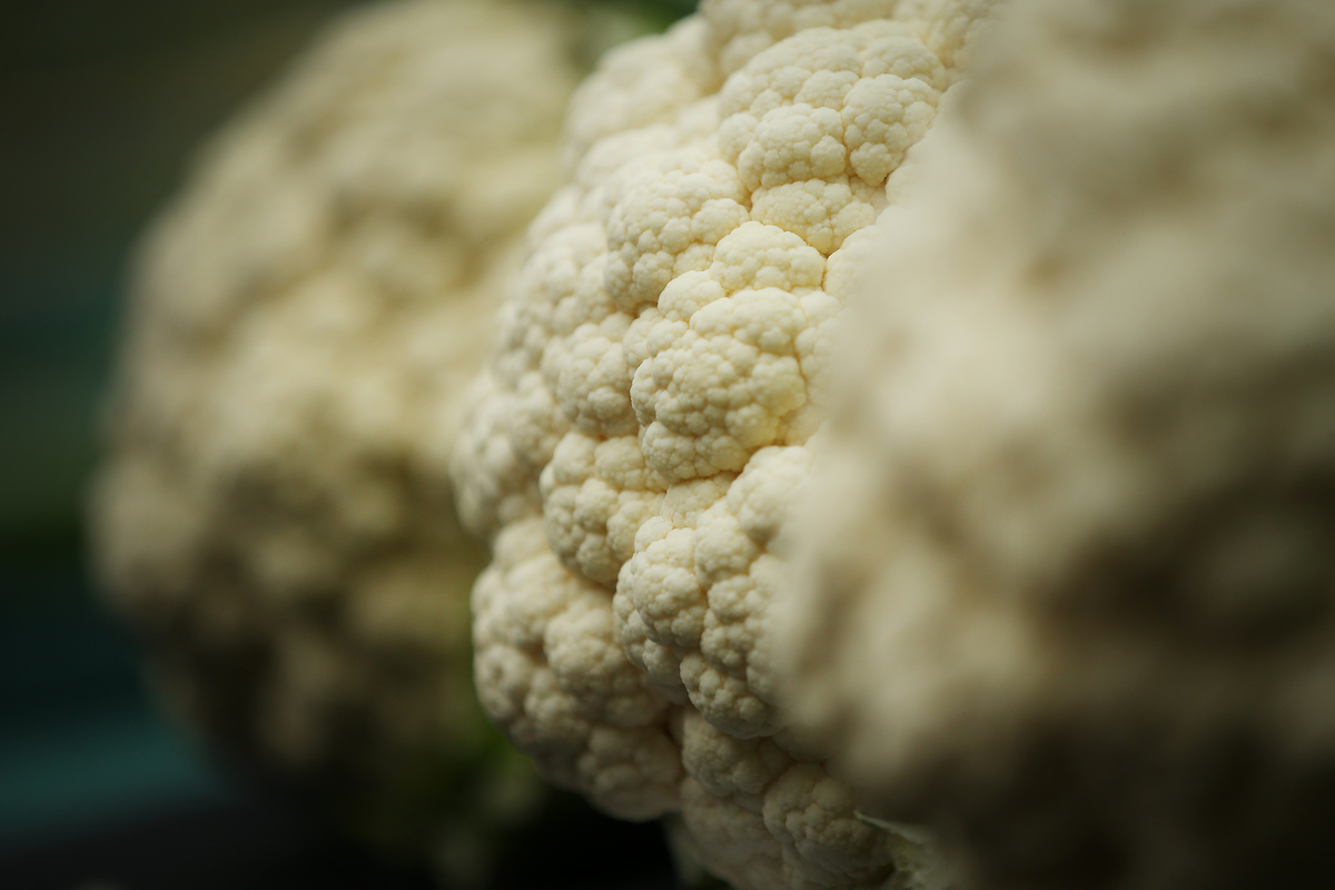 Close-up shows cauliflower heads.