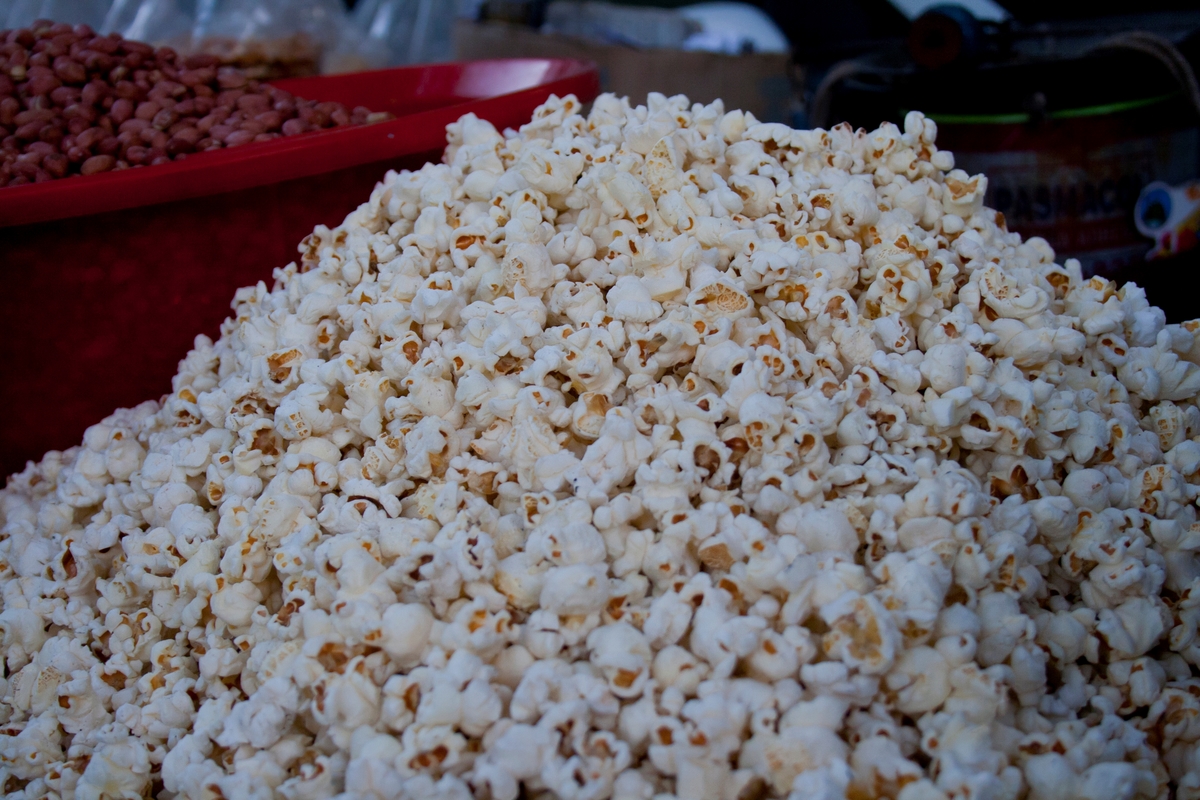 Popcorn is sold in a big pile.