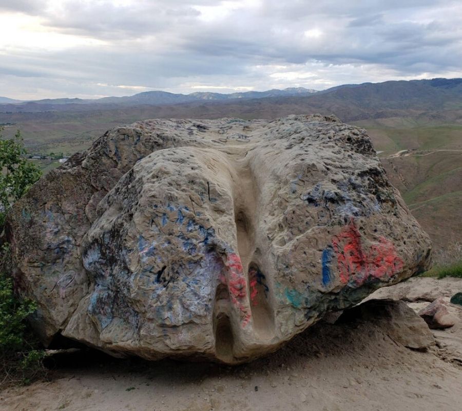 a rock with foot steps worn in