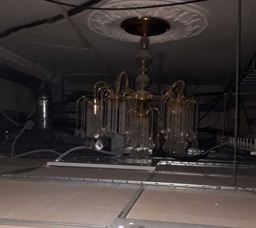 a drop ceiling put over a chandelier 