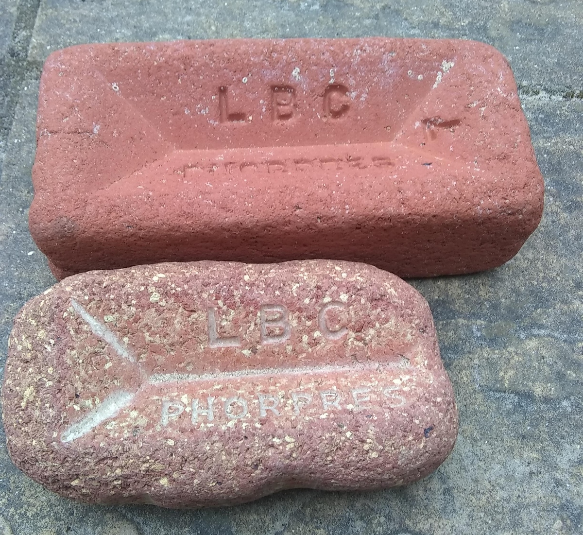 two of the same bricks side by side but one has eroded to half the size