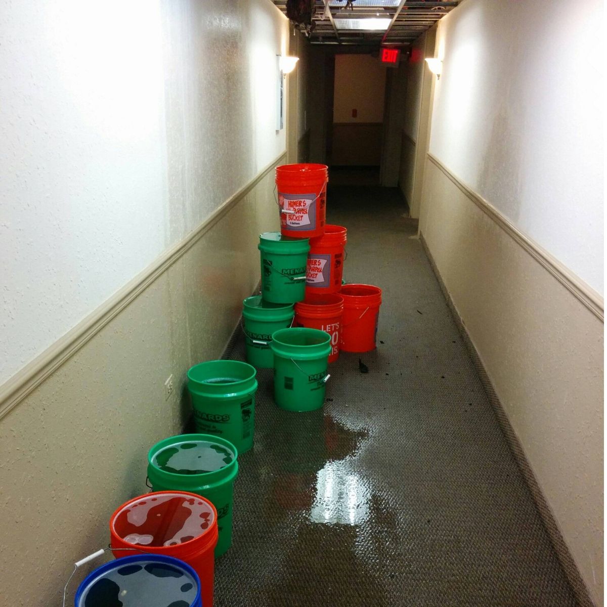 hole in the roof fixed with buckets