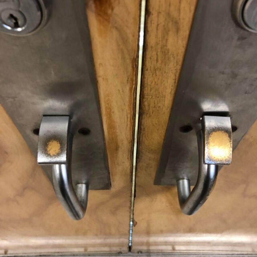left and right handle on door where right handle has more wear and tear