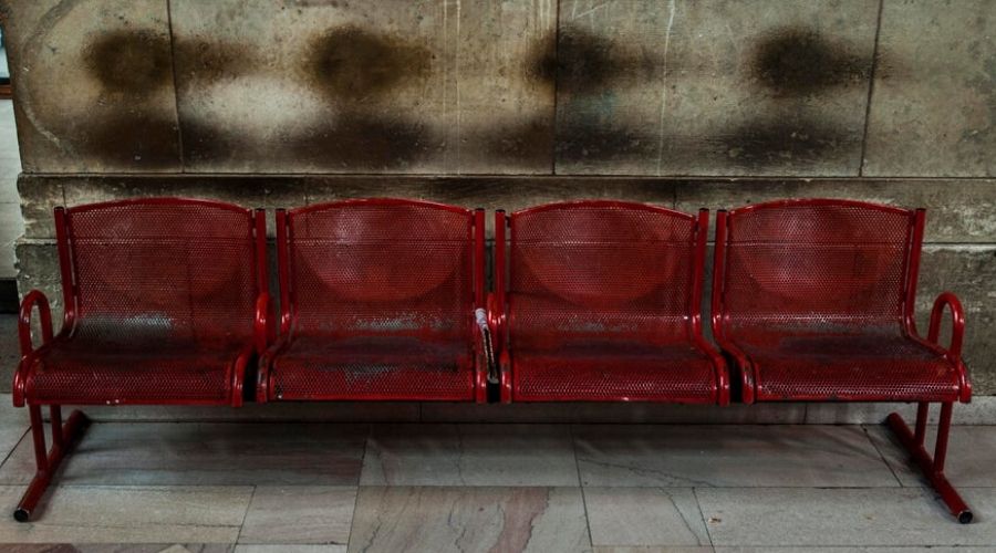 outline of people sitting on benches