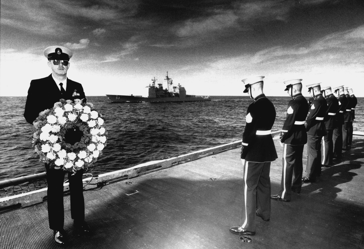 Senior Chief Master Jim Harnes (L) attends a service to commemorate the battle of the coral sea, 1992.