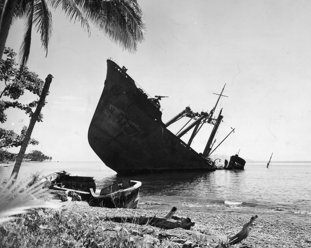 A Japanese naval vessel lies half-submerged offshore, sunk by the U.S. Navy in the battles at Guadalcanal, Solomon Islands, 1942.