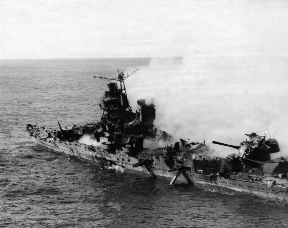 The badly hit Japanese cruiser 'Mikuma' is on fire during the 1942 Battle of Midway.