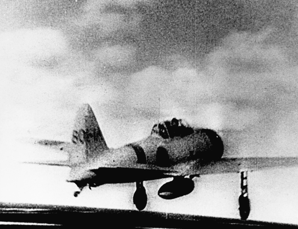 A Japanese Mitsubishi A6M Zero-Sen fighter aircraft takes off to participate in the Battle of Midway.