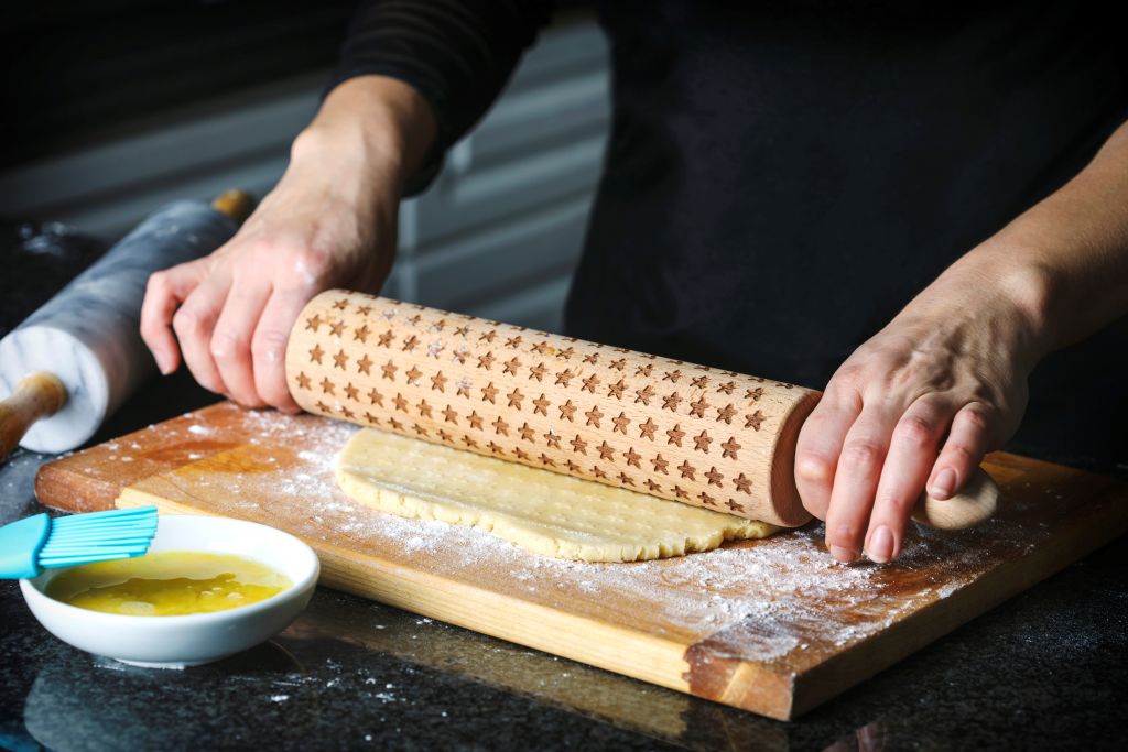 woman making a pie from flaky pastry dough