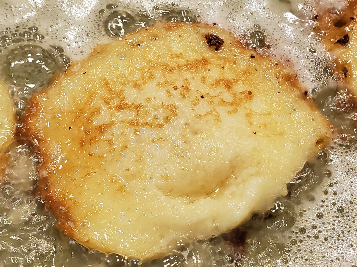 Bread fries in oil.