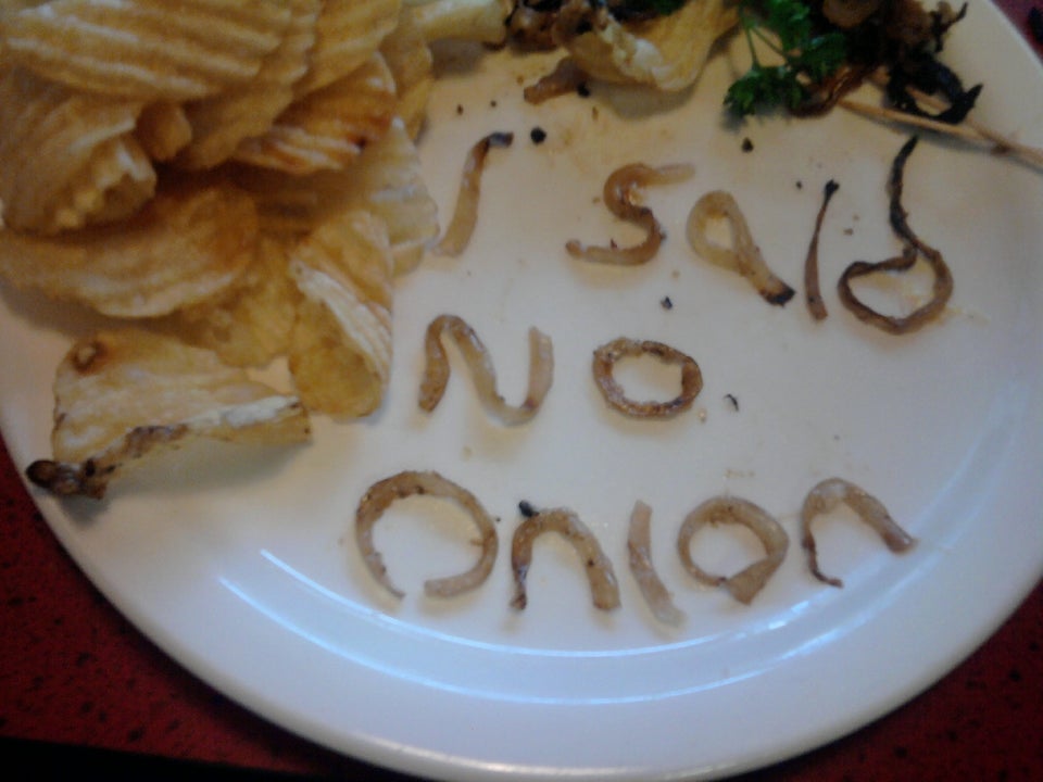 no onion at a restaurant, spelled out with the onion left on food
