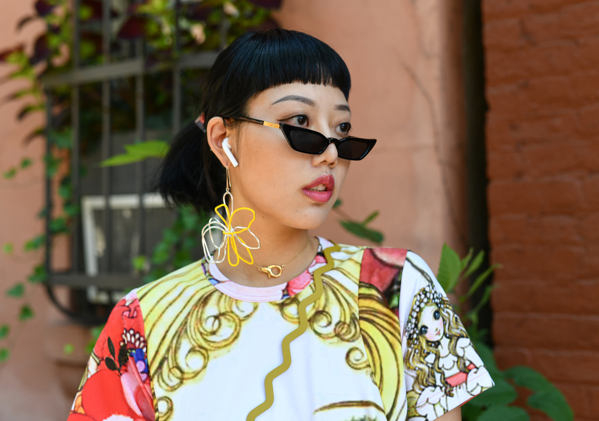 A woman has short bangs.