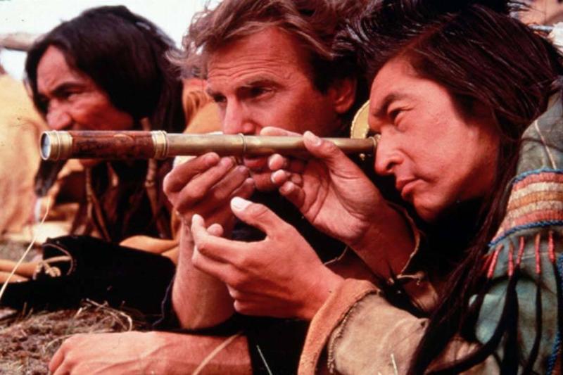 Actors laying in the grass