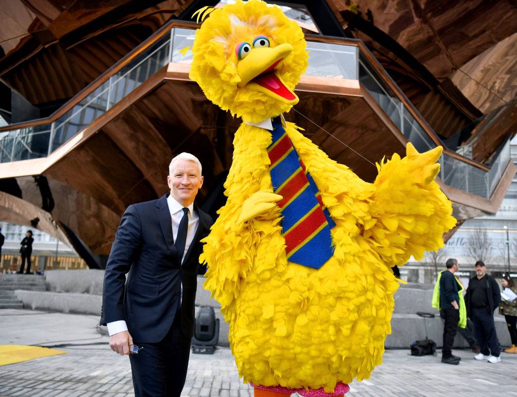 big bird and cooper posing for a photo