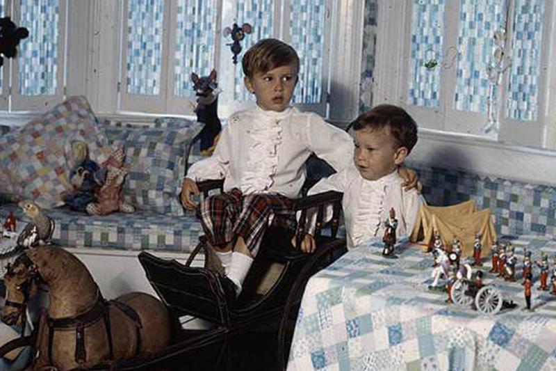cooper with his brother in their childhood mansion