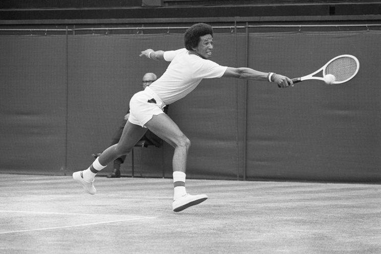 american-tennis-player-arthur-ashe-grimaces-as-he-hits-a-news-photo-1573930427