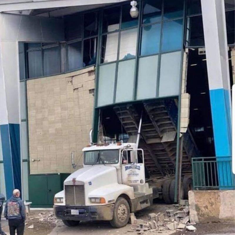 dump truck destroyed the building