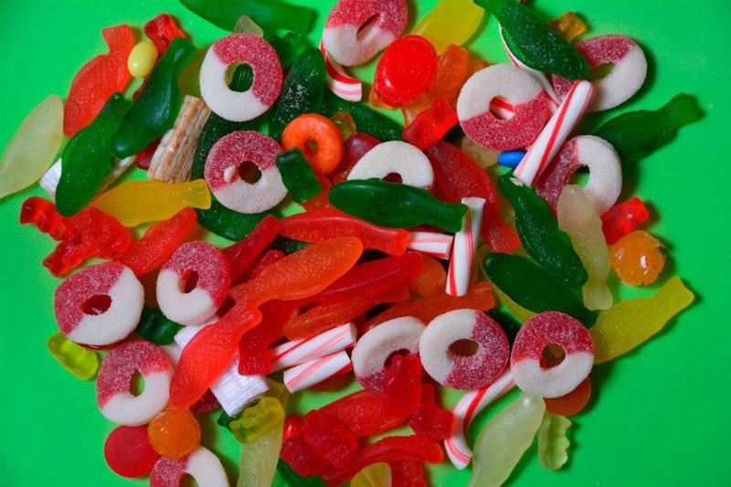 assorted fruit snacks against a lime green background