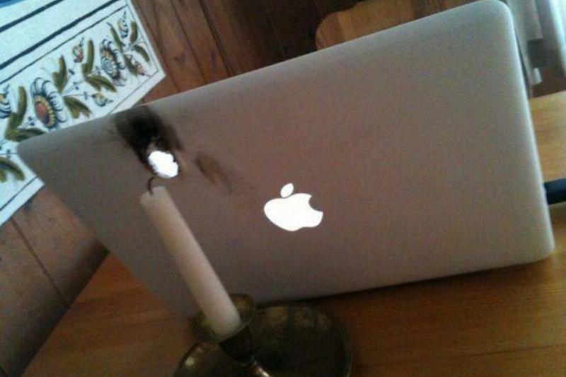 burnt laptop with candle