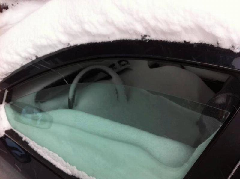 window of car left open during blizzard
