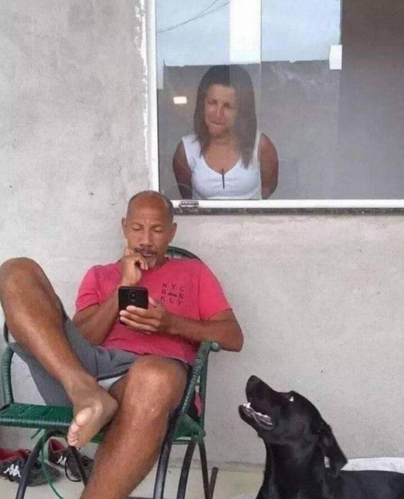 wife looking over husband's shoulder at phone