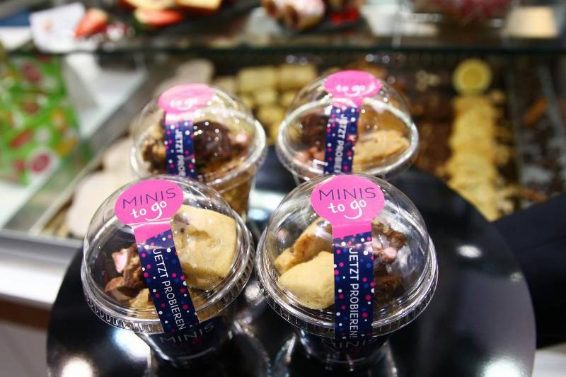 Miniature pastries are packaged and sold to-go.