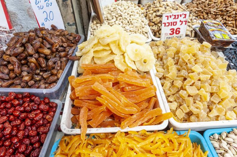 Dried fruit is displayed and sold at a market in Israel.