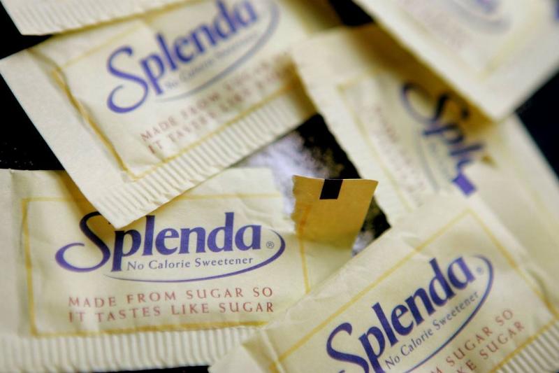 Packets of Splenda lie on a table.