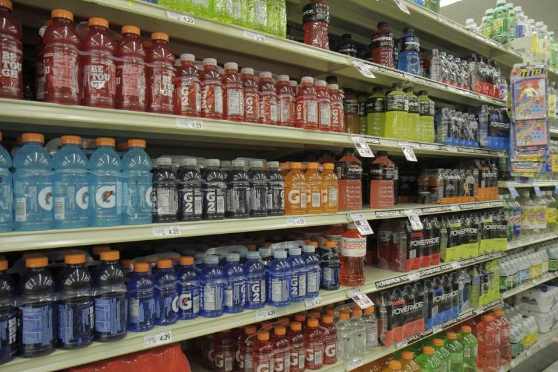 Shelves of sports drinks are for sale at a supermarket.