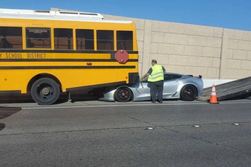 sportscar that got stuck under school bus in accident