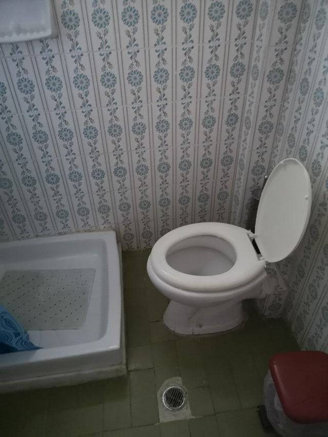 toilet very close to shower