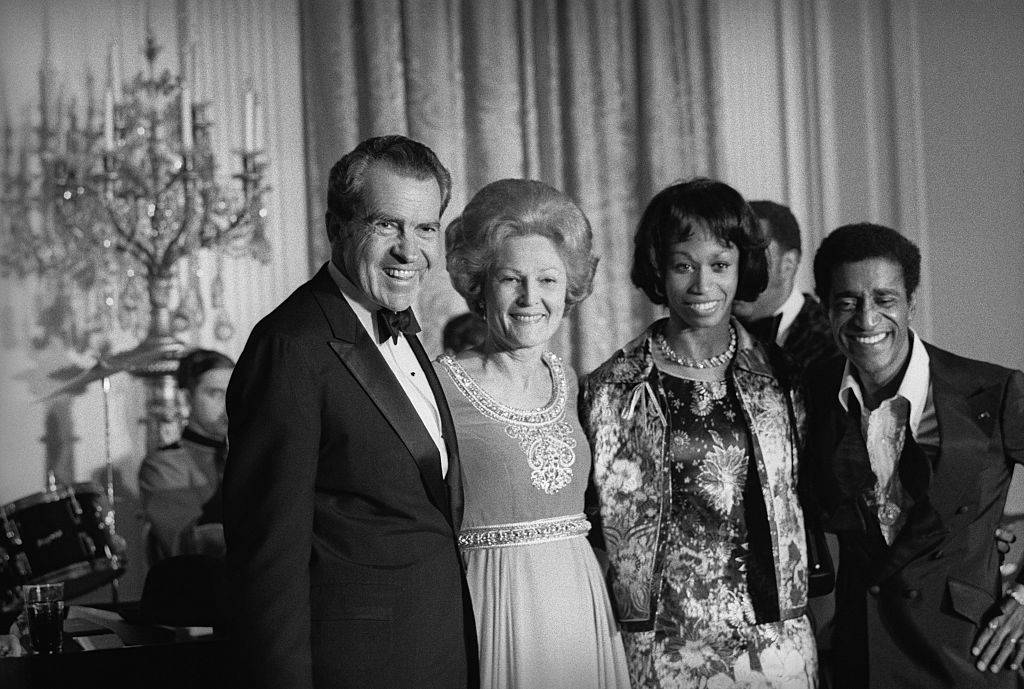 Entertainer Sammy Davis, Jr., (right) acknowledges ovation following his performance at a White House gala. 