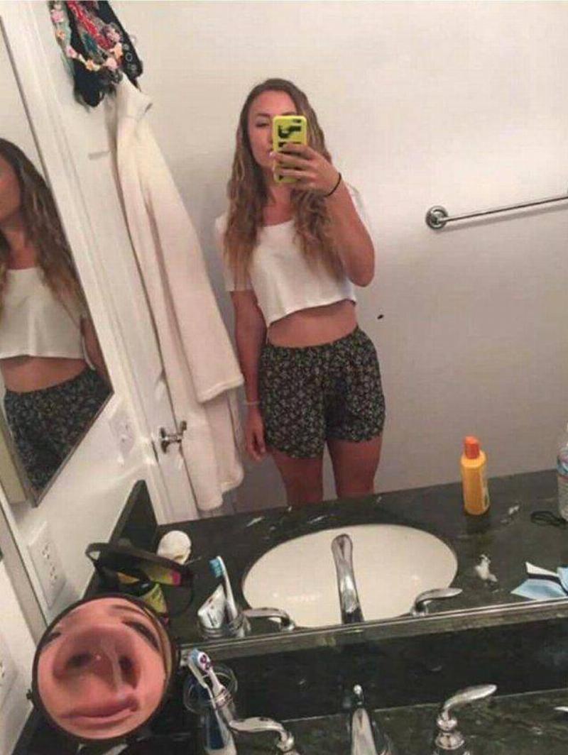 girl taking photo at bad angle for nose