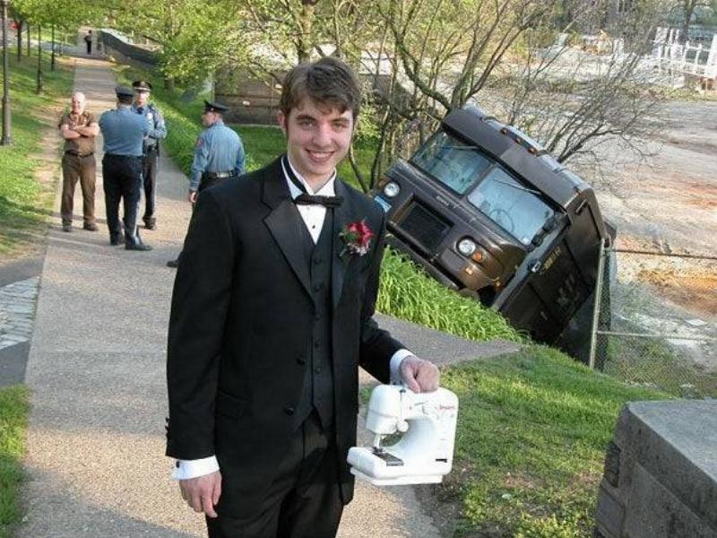guy with sewing machine in front of a sinking UPS truck