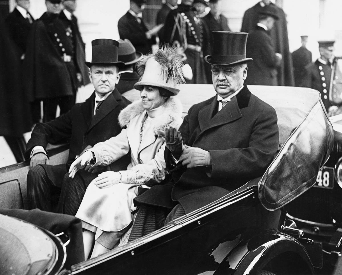 President Calvin Coolidge and his wife  Grace drive to the inauguration.