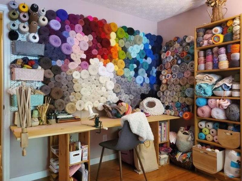 organized sewing room full of yarn